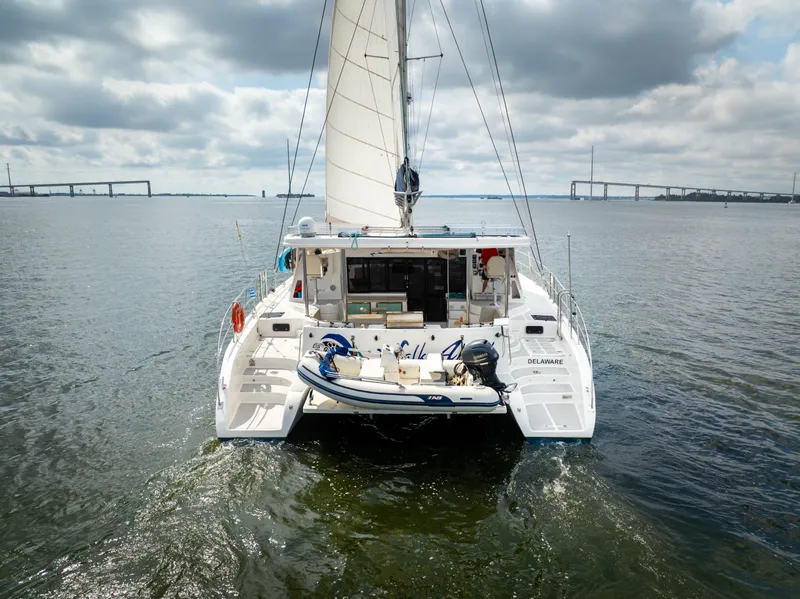 Slide: The Image of 2019 Royal Cape Catamarans Majestic 530 sailing on open water under cloudy skies. - 2