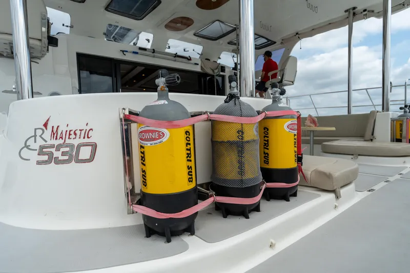 Slide: The Image of 2019 Royal Cape Catamarans Majestic 530 with scuba tanks on deck. - 22