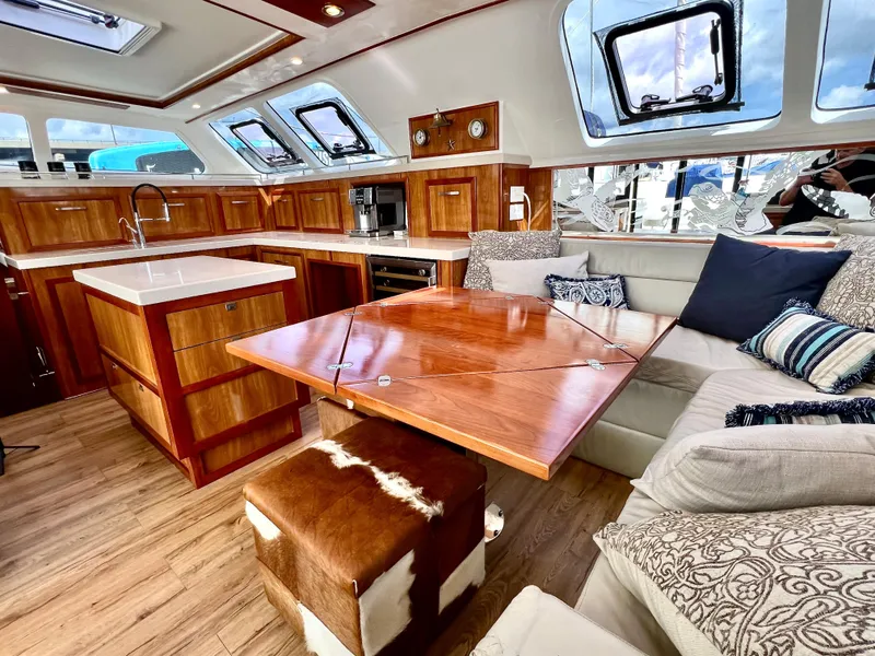 Slide: The Image of Luxurious 2019 Royal Cape Catamarans 530 interior with elegant wood finishes and spacious seating. - 28