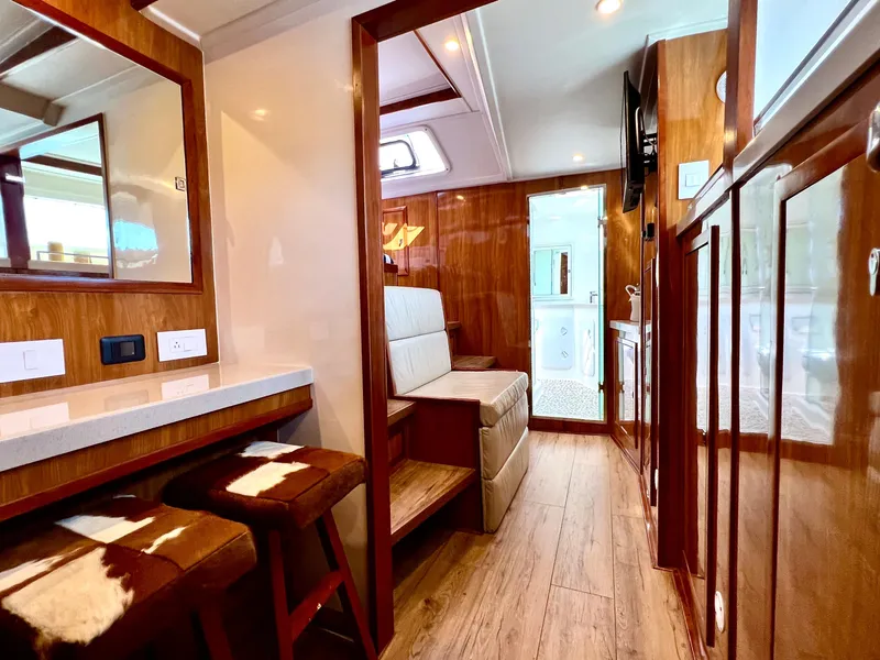 Slide: The Image of Luxurious 2019 Royal Cape Catamarans 530 interior with wood finishes and modern seating. - 35