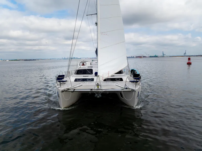 Slide: The Image of 2019 Royal Cape Catamarans Majestic 530 sailing on calm waters under cloudy skies. - 4