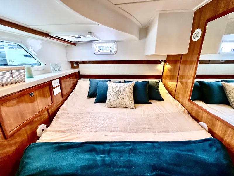 Slide: The Image of Luxurious cabin interior of 2019 Royal Cape Catamarans 530 with cozy bedding. - 40