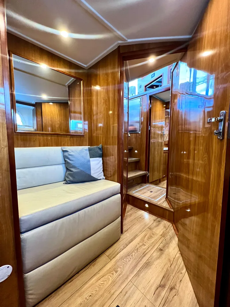 Slide: The Image of Luxurious interior of 2019 Royal Cape Catamarans 530 with wood finish and cozy seating. - 42