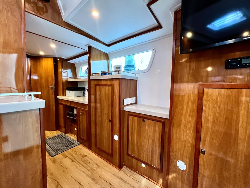 Slide: The Image of Luxurious 2019 Royal Cape Catamarans 530 interior with wood finish and modern amenities. - 43