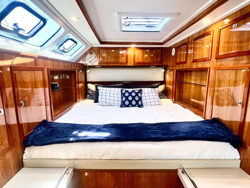 Slide: The Image of Luxurious cabin interior of 2019 Royal Cape Catamarans 530 with wood paneling and skylights. - 46