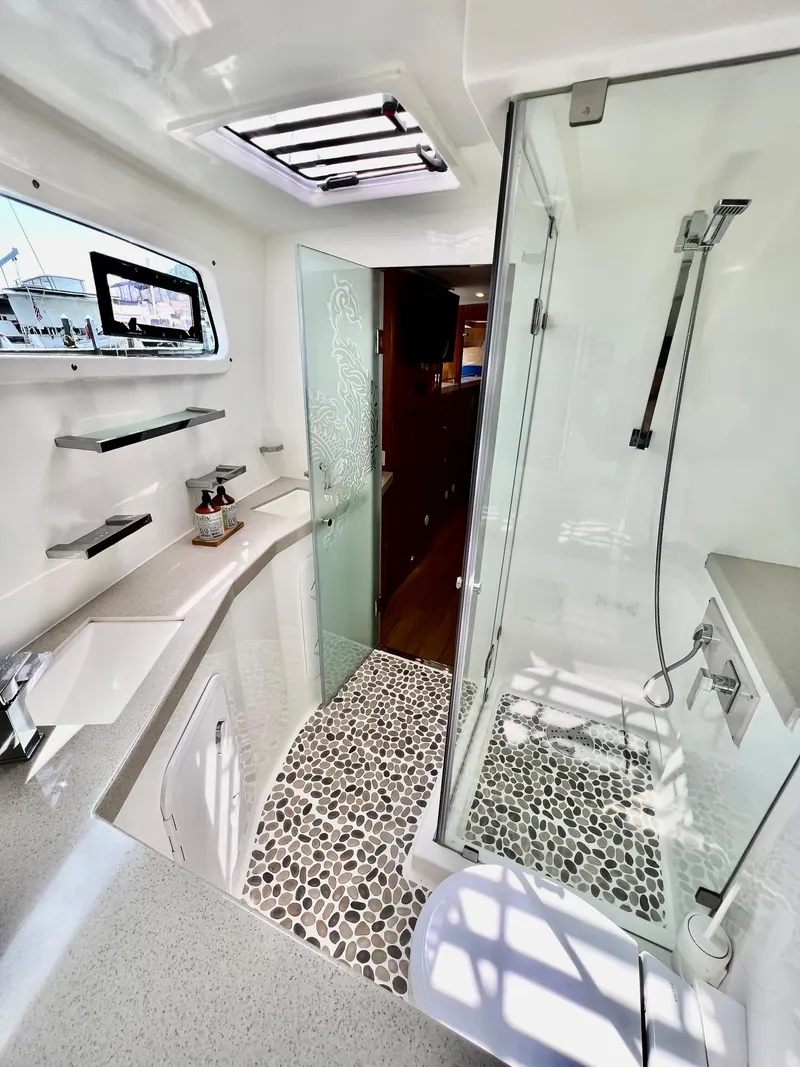 Slide: The Image of Luxurious 2019 Royal Cape Catamarans 530 bathroom with modern shower and sleek design. - 49