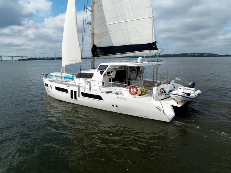 Slide: The Image of 2019 Royal Cape Catamarans Majestic 530 sailing on calm waters under cloudy skies. - 5