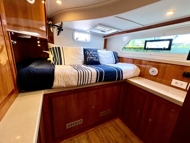 Slide: The Image of Luxurious cabin interior of 2019 Royal Cape Catamarans 530 with cozy bedding. - 50