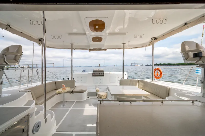 Slide: The Image of Spacious deck of 2019 Royal Cape Catamarans Majestic 530 with seating and ocean view. - 8