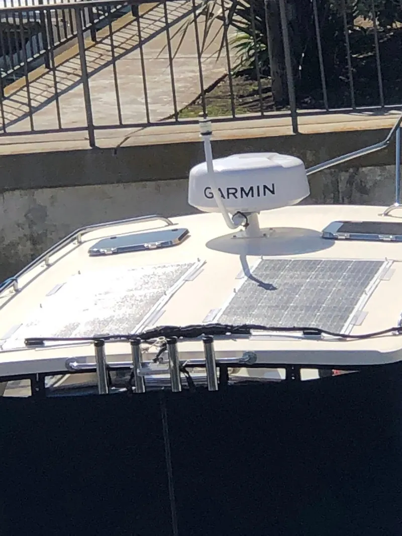 Slide: The Image of 2004 Mainship Pilot 30-II Sedan with Garmin radar on deck. - 14