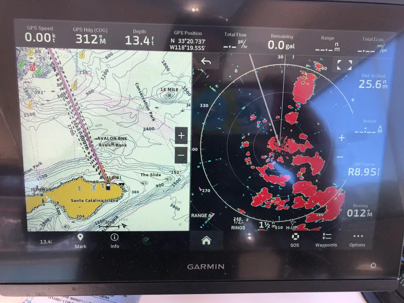 Slide: The Image of Garmin marine navigation display showing Santa Catalina Island map and radar data on Mainship Pilot 30-II Sedan. - 19