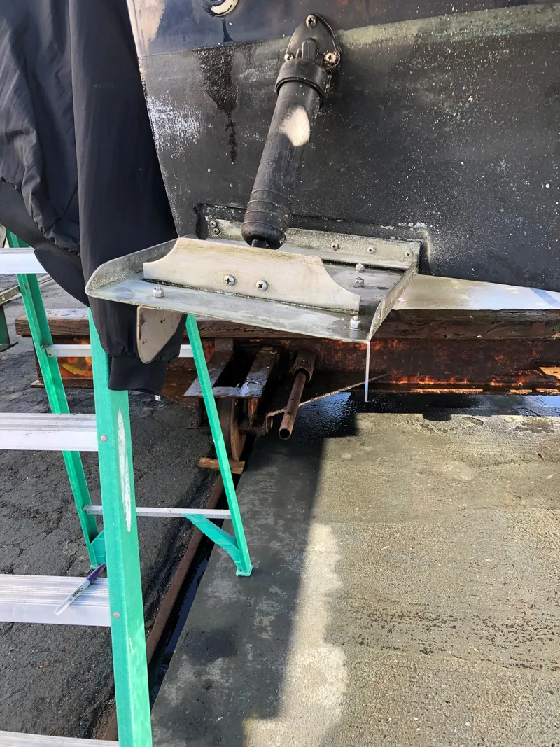 Slide: The Image of 2004 Mainship Pilot 30-II Sedan boat hull with ladder and maintenance equipment. - 30