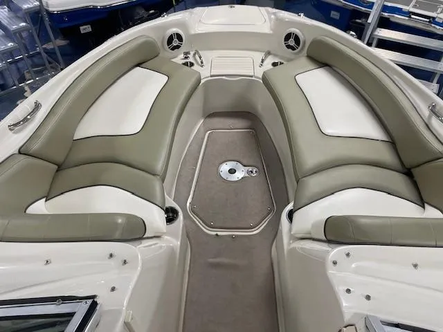 Slide: The Image of 2006 Sea Ray 240 Sundeck interior with spacious seating and modern design. - 7