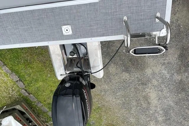 Slide: The Image of 2026 Sun Tracker Party Barge 20 DLX with Mercury outboard motor, top view. - 12