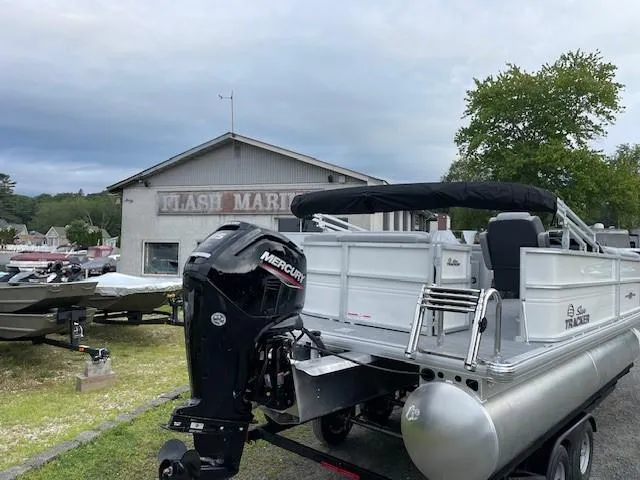 Slide: The Image of 2026 Sun Tracker Party Barge 20 DLX pontoon boat with Mercury engine at marina. - 4