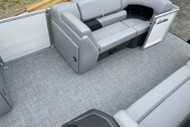Slide: The Image of 2026 Sun Tracker Party Barge 20 DLX interior with gray seating and flooring. - 9
