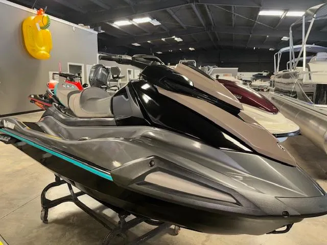 Slide: The Image of 2023 Yamaha WaveRunner VX Cruiser in showroom, sleek design, black and gray color scheme. - 1