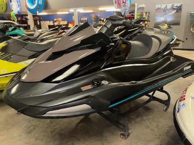 Slide: The Image of 2023 Yamaha WaveRunner VX Cruiser in showroom, sleek design, black and gray color. - 4