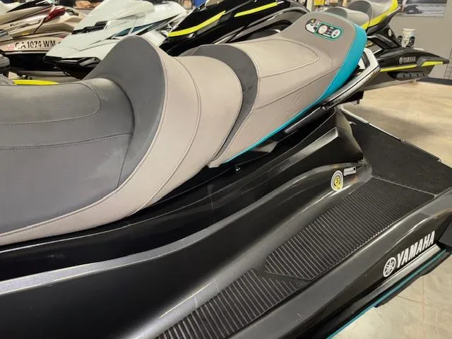 Slide: The Image of 2023 Yamaha WaveRunner VX Cruiser with sleek design and comfortable seating in showroom. - 5