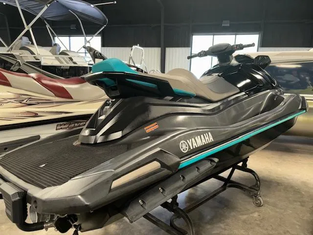 Slide: The Image of 2023 Yamaha WaveRunner VX Cruiser in showroom, black and teal design. - 8