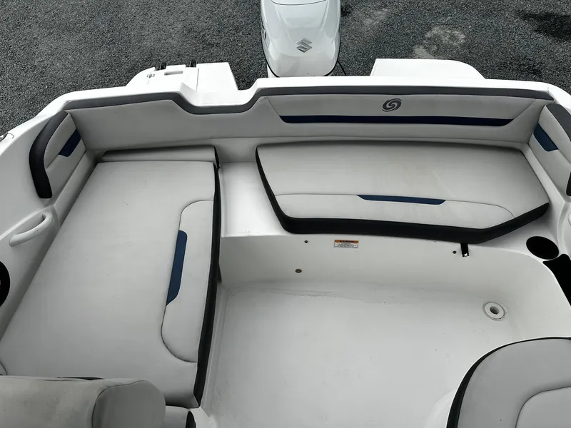 Slide: The Image of 2021 Godfrey Hurricane 205SS boat interior with cushioned seating and sleek design. - 10