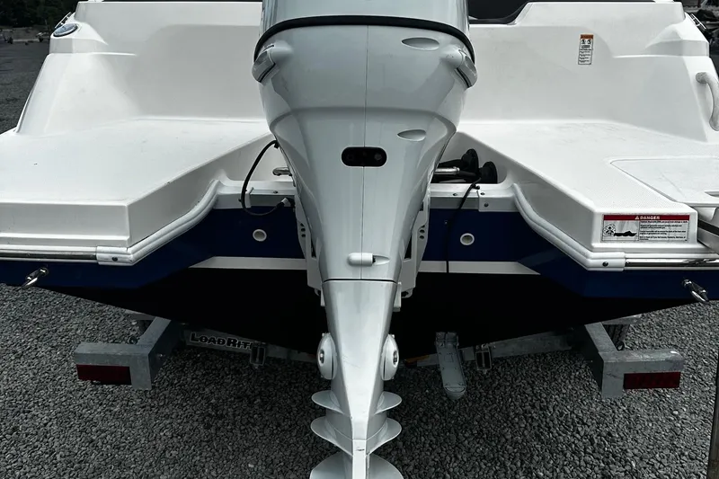 Slide: The Image of 2021 Godfrey Hurricane 205SS boat rear view with outboard motor. - 13