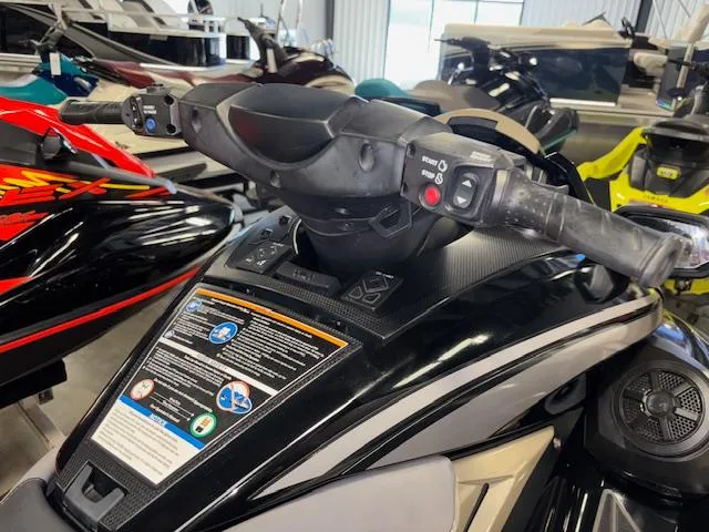 Slide: The Image of 2023 Yamaha WaveRunner FX Cruiser SVHO handlebars in a showroom setting. - 10