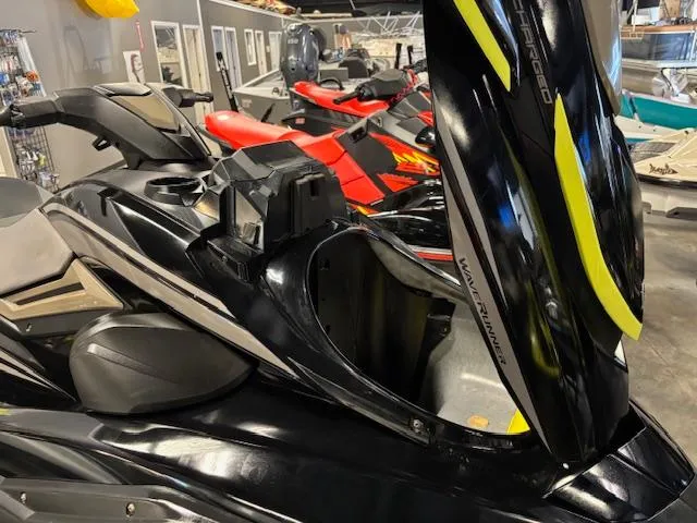 Slide: The Image of 2023 Yamaha WaveRunner FX Cruiser SVHO in showroom, black with yellow accents. - 15