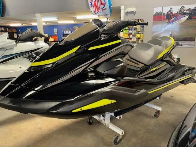 Slide: The Image of 2023 Yamaha WaveRunner FX Cruiser SVHO in showroom, black with yellow accents. - 3