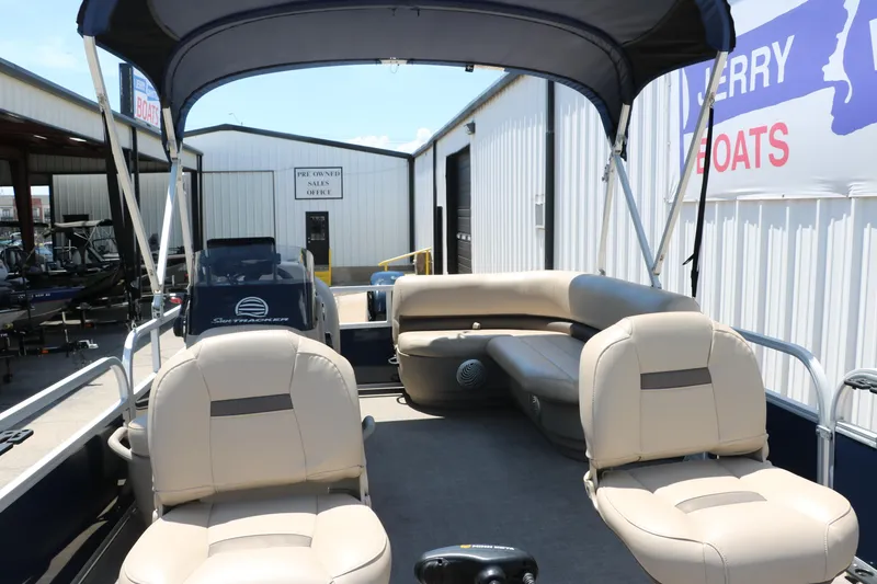 Slide: The Image of 2021 Sun Tracker Bass Buggy 16 XL pontoon boat interior with seating and canopy. - 14