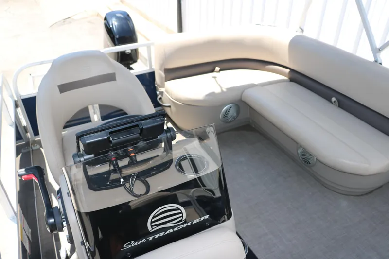 Slide: The Image of 2021 Sun Tracker Bass Buggy 16 XL interior with seating and console. - 17