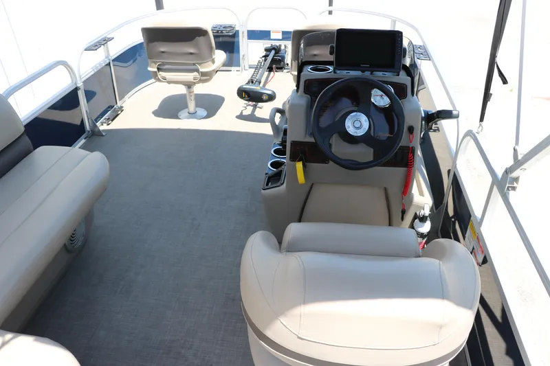 Slide: The Image of 2021 Sun Tracker Bass Buggy 16 XL interior with steering console and seating. - 18