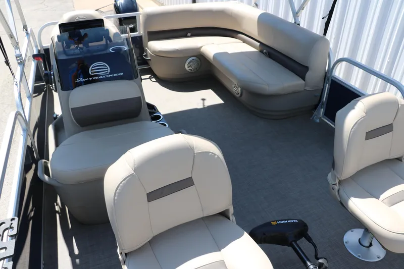 Slide: The Image of 2021 Sun Tracker Bass Buggy 16 XL pontoon boat interior with beige seating. - 21