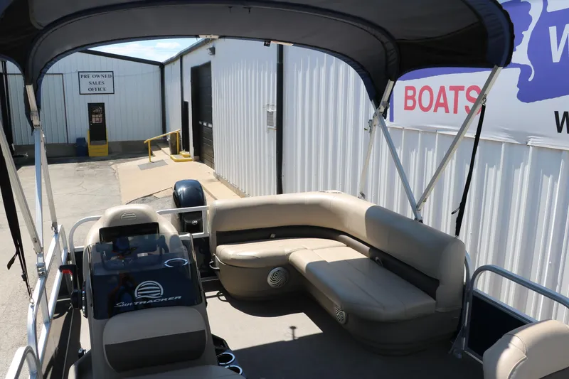 Slide: The Image of 2021 Sun Tracker Bass Buggy 16 XL pontoon boat interior at dealership. - 22