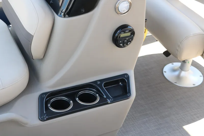 Slide: The Image of 2021 Sun Tracker Bass Buggy 16 XL boat interior with cup holders and control panel. - 27