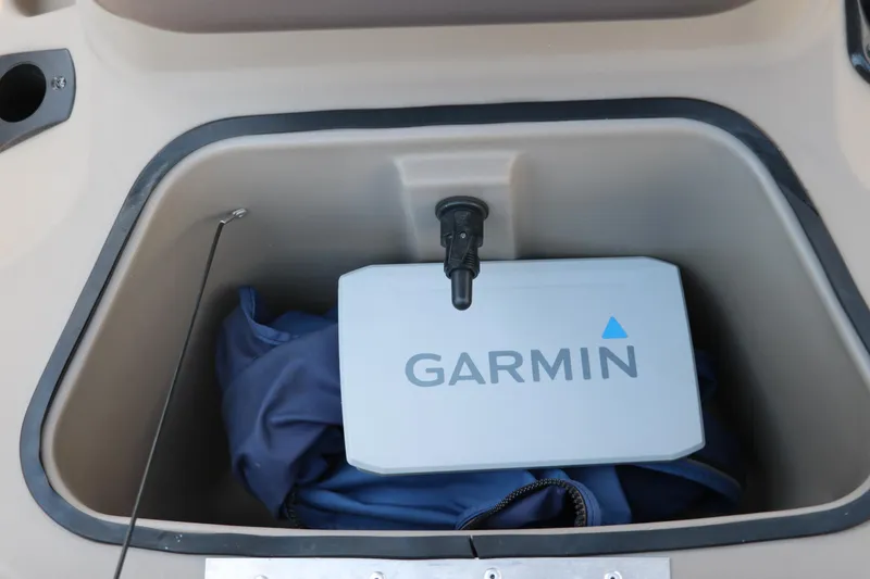 Slide: The Image of Storage compartment in 2021 Sun Tracker Bass Buggy 16 XL with Garmin device. - 29