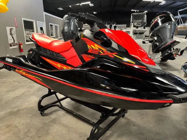 Slide: The Image of 2021 Yamaha WaveRunner EX Sport in red and black, displayed indoors. - 1