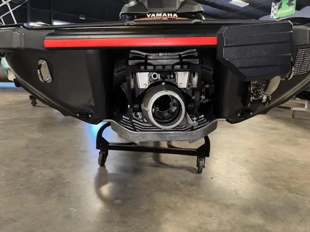 Slide: The Image of 2021 Yamaha WaveRunner EX Sport rear view in showroom, showcasing engine and design details. - 13