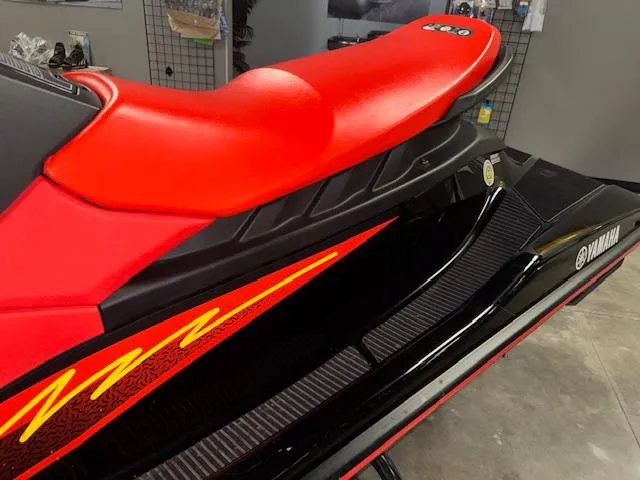 Slide: The Image of 2021 Yamaha WaveRunner EX Sport with vibrant red seat and sleek black design. - 5