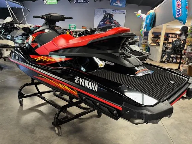 Slide: The Image of 2021 Yamaha WaveRunner EX Sport in showroom, black and red design, side view. - 6