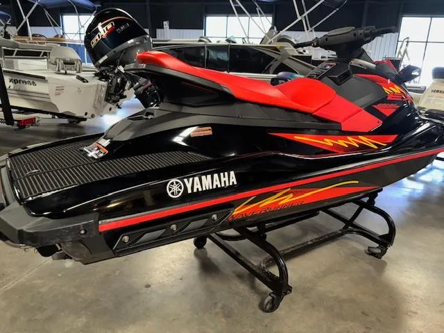 Slide: The Image of 2021 Yamaha WaveRunner EX Sport in showroom, black and red design, on display stand. - 8