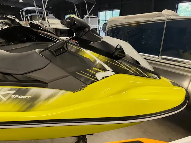 Slide: The Image of 2023 Yamaha WaveRunner EX Sport in vibrant yellow and black, displayed indoors. - 10