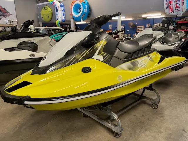 Slide: The Image of 2023 Yamaha WaveRunner EX Sport in vibrant yellow on display in showroom. - 3