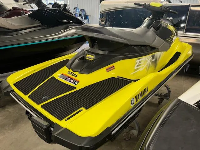 Slide: The Image of 2023 Yamaha WaveRunner EX Sport in vibrant yellow, displayed indoors. - 8