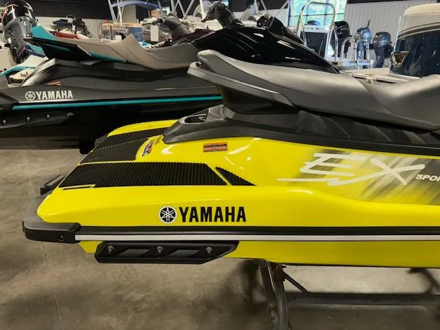 Slide: The Image of 2023 Yamaha WaveRunner EX Sport in vibrant yellow, displayed in a showroom. - 9