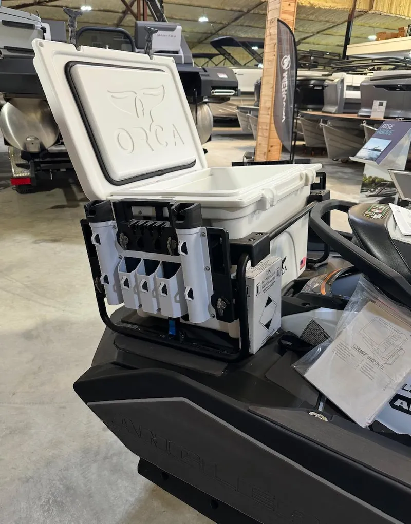 Slide: The Image of 2025 Kawasaki Ultra 160 LXS Angler jet ski on ocean, man fishing. - 6