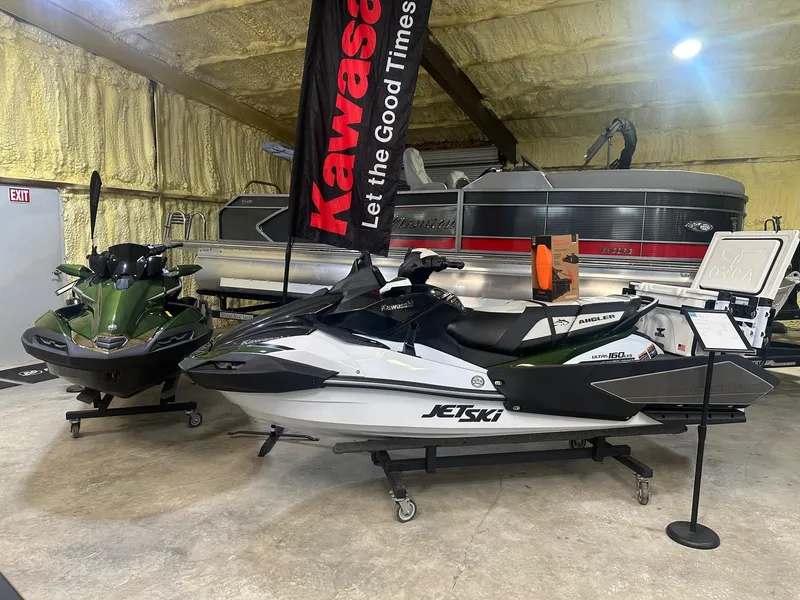 Slide: The Image of 2025 Kawasaki Ultra 160 LXS Angler on ocean at sunset, person fishing. - 9