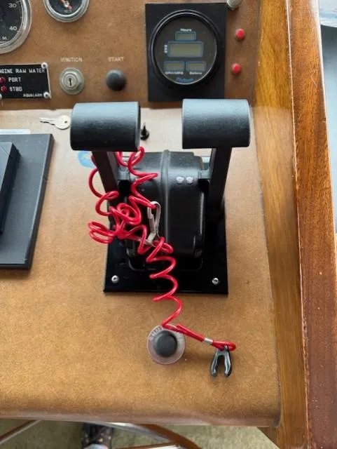 Slide: The Image of Throttle controls on a 1978 Hatteras 58 Cockpit Motor Yacht dashboard. - 12