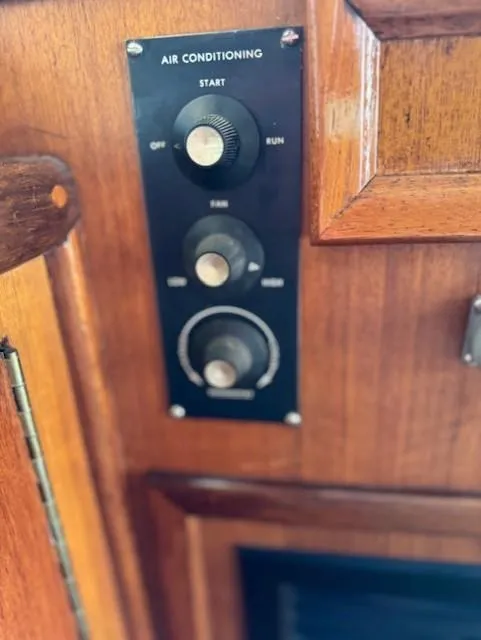 Slide: The Image of Air conditioning control panel on 1978 Hatteras 58 Cockpit Motor Yacht, wooden interior. - 18