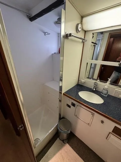 Slide: The Image of Bathroom interior of 1978 Hatteras 58 Cockpit Motor Yacht with shower and sink. - 33
